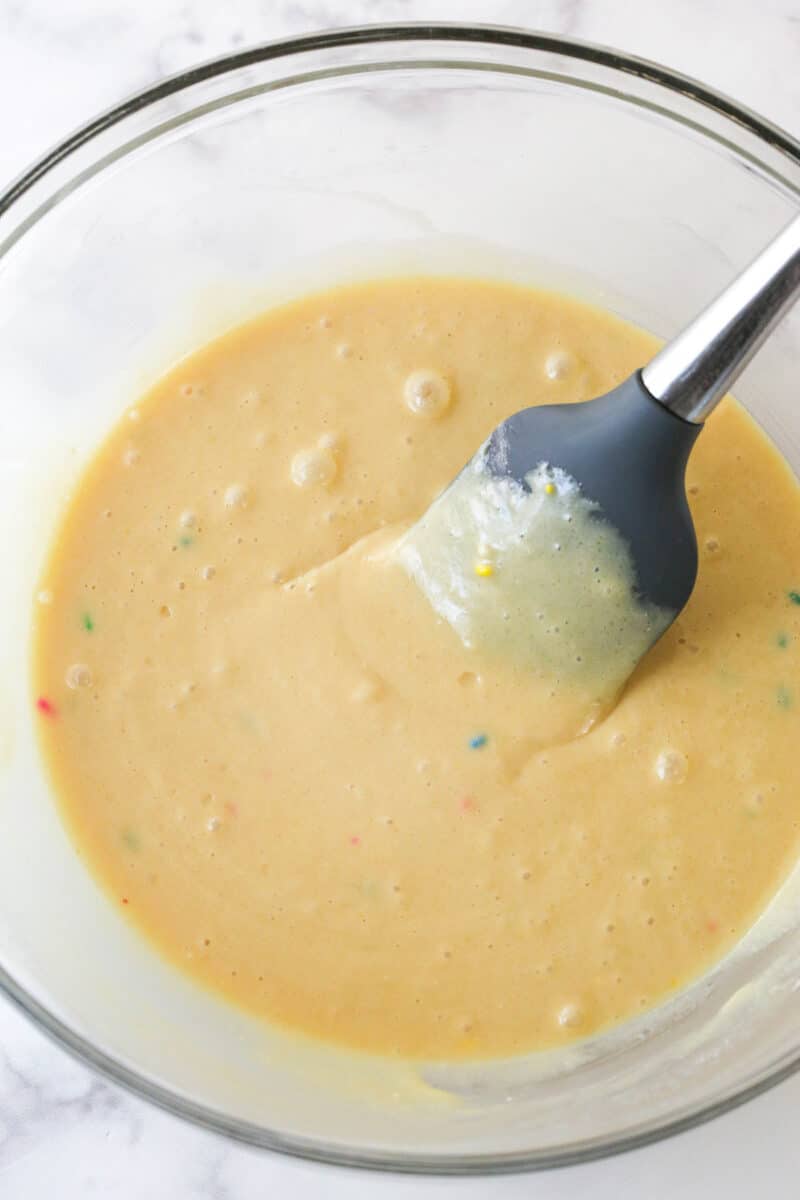sweetened condensed milk, cake mix, milk and vanilla extract combined in large glass bowl