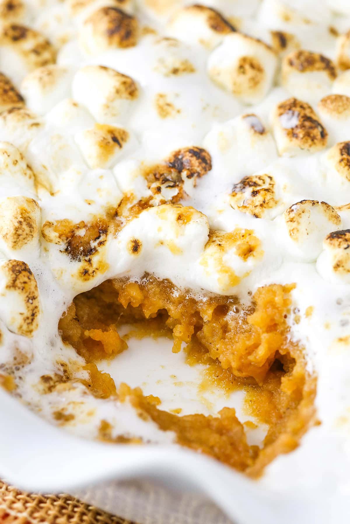 Sweet Potato Casserole with a scoop taken out.