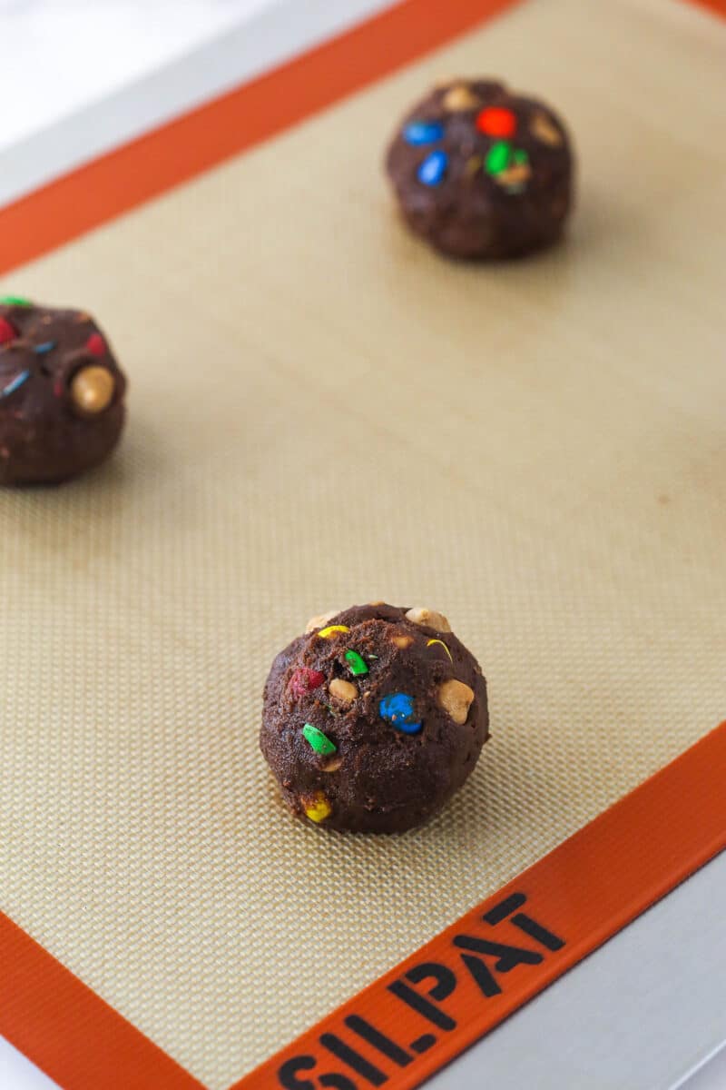 Balls of peanut butter M&M chocolate cookie dough