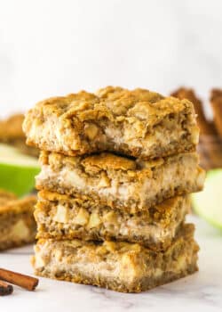 A stack of apple cheesecake oatmeal cookie bars