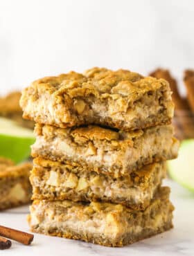 A stack of apple cheesecake oatmeal cookie bars