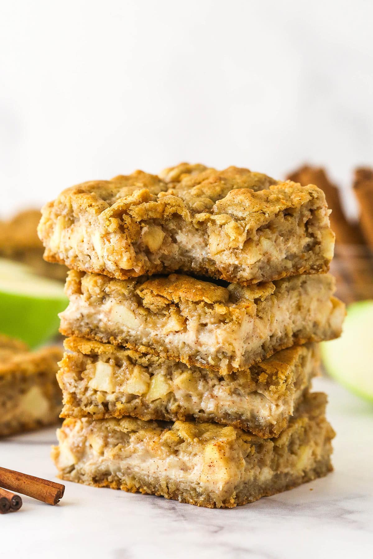 A stack of apple cheesecake oatmeal cookie bars