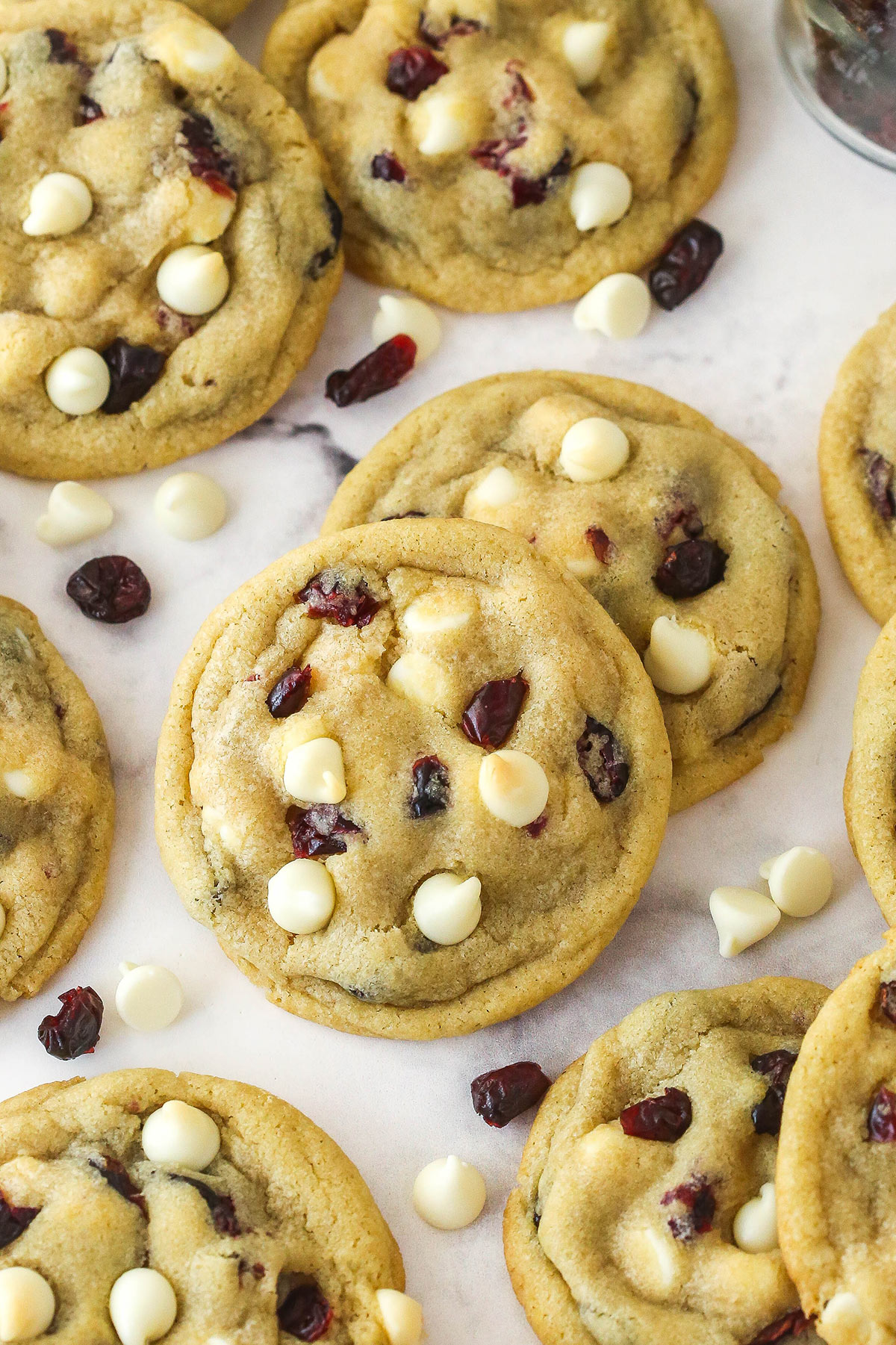 Overhead view of cranberry white chocolate chip cookies on the counter