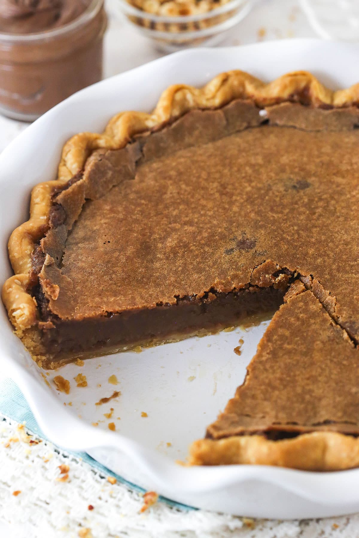 chocolate hazelnut chess pie with a slice removed