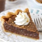 slice of chocolate hazelnut chess pie on a white plate