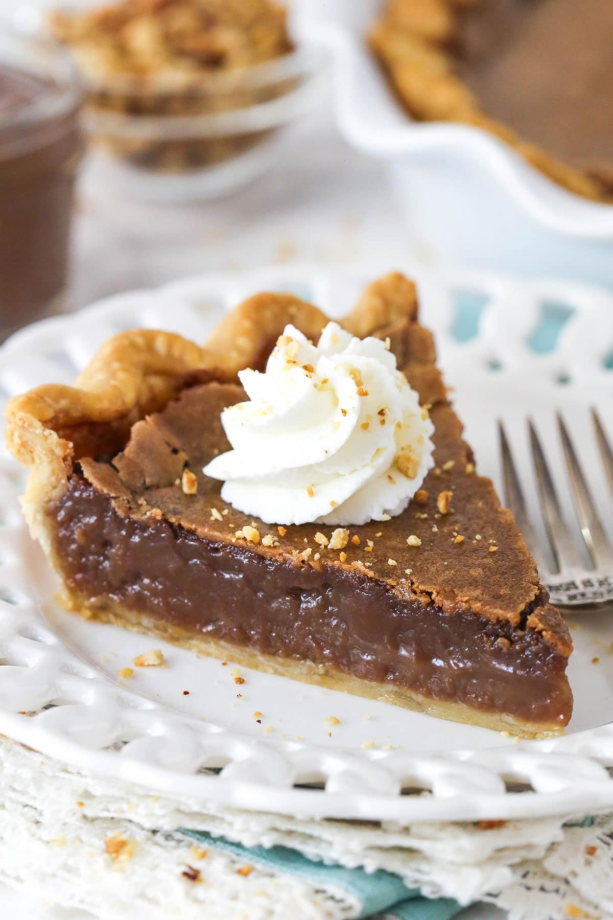 slice of chocolate hazelnut chess pie on a white plate