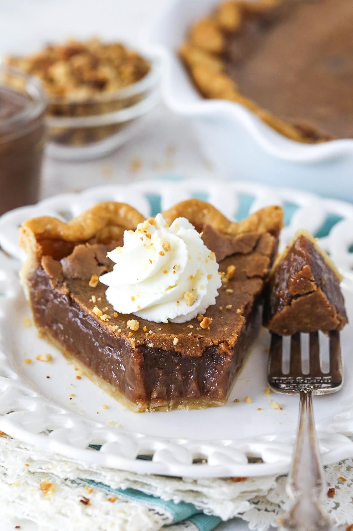 slice of chocolate hazelnut chess pie with a bite taken