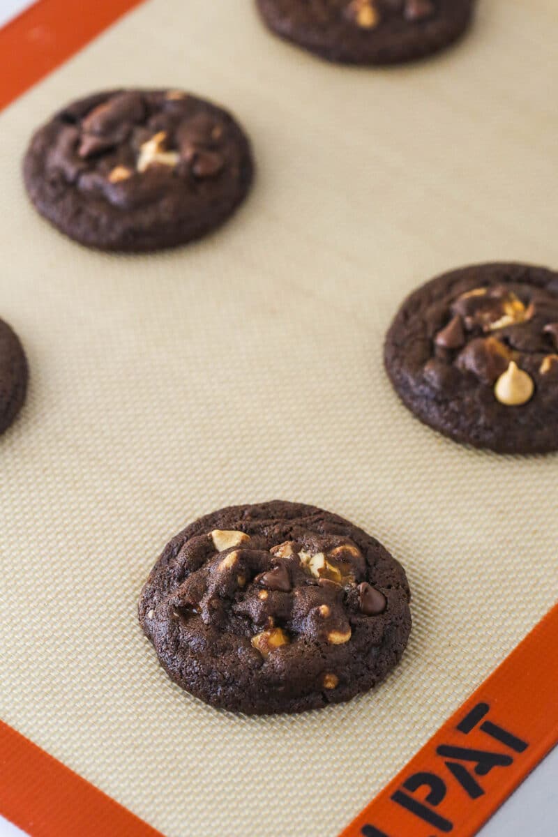 Freshly baked Snickers cookies on a baking sheet