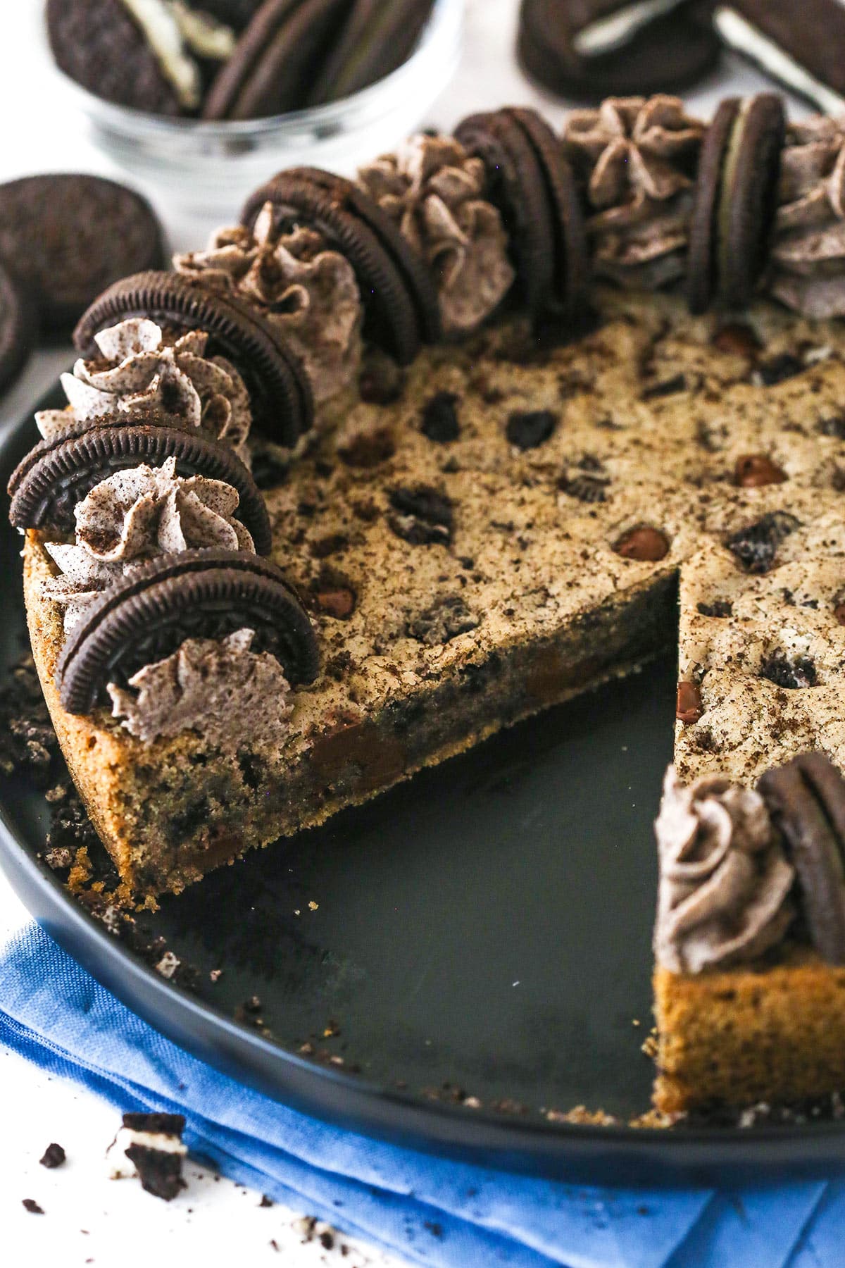 An Oreo cookie cake with one slice missing