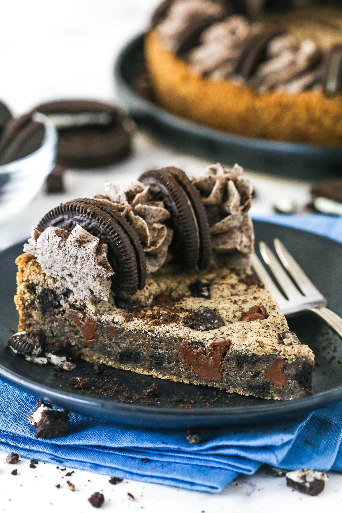 A slice of Oreo cookie cake on a plate