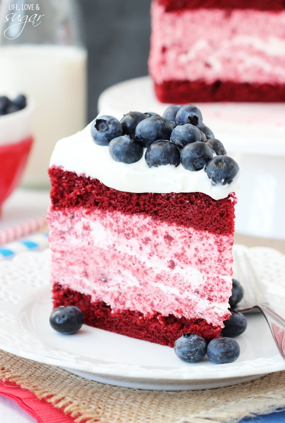 Red velvet cake with frosting and blueberry sauce • Simply Family Living