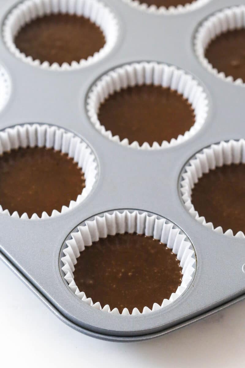 Chocolate cupcake batter in cupcake liners