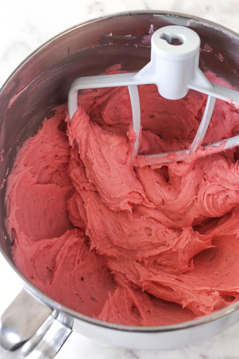 Mixing raspberry buttercream frosting