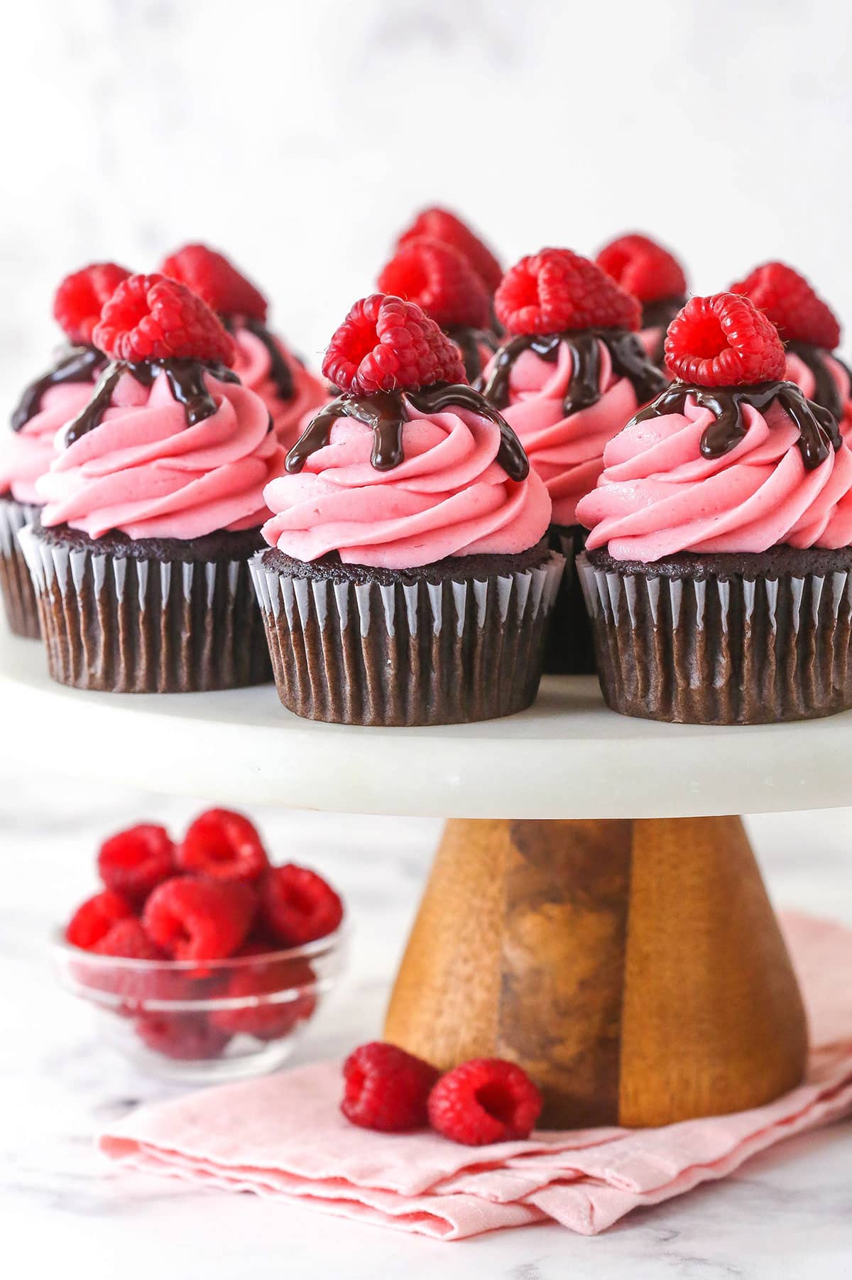 Raspberry chocolate cupcakes on a cake stand