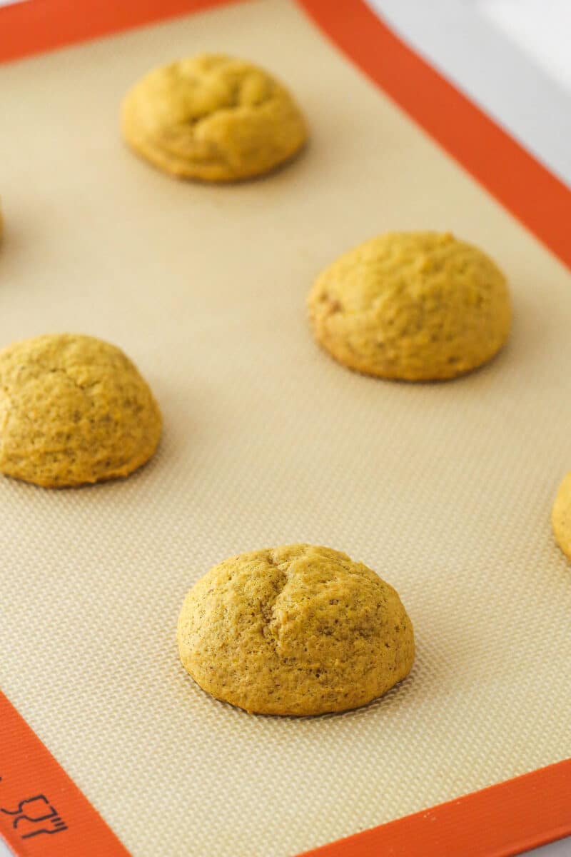 Freshly baked pumpkin cookies on a baking sheet