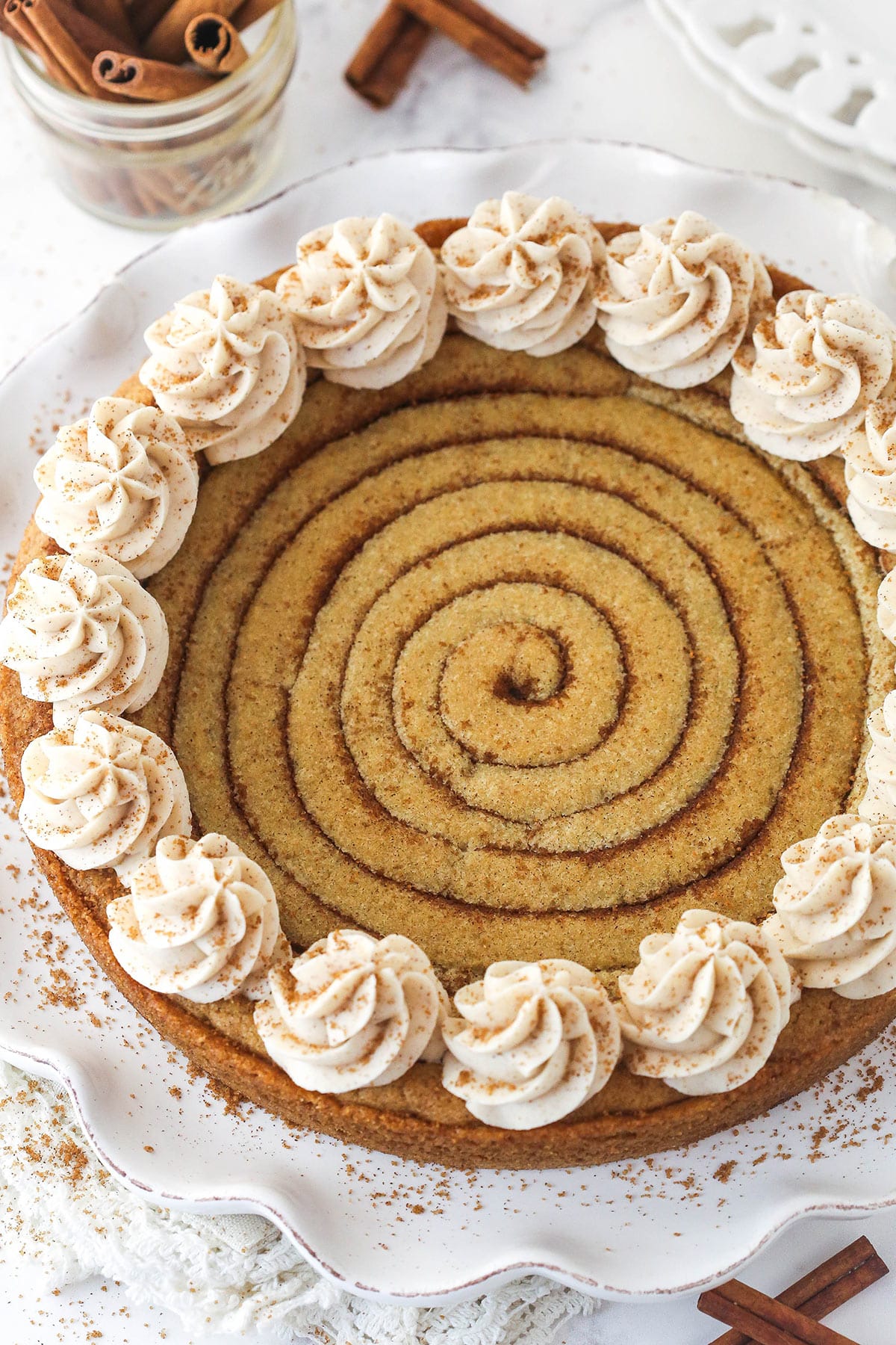 Overhead view of a cinnamon roll cookie cake