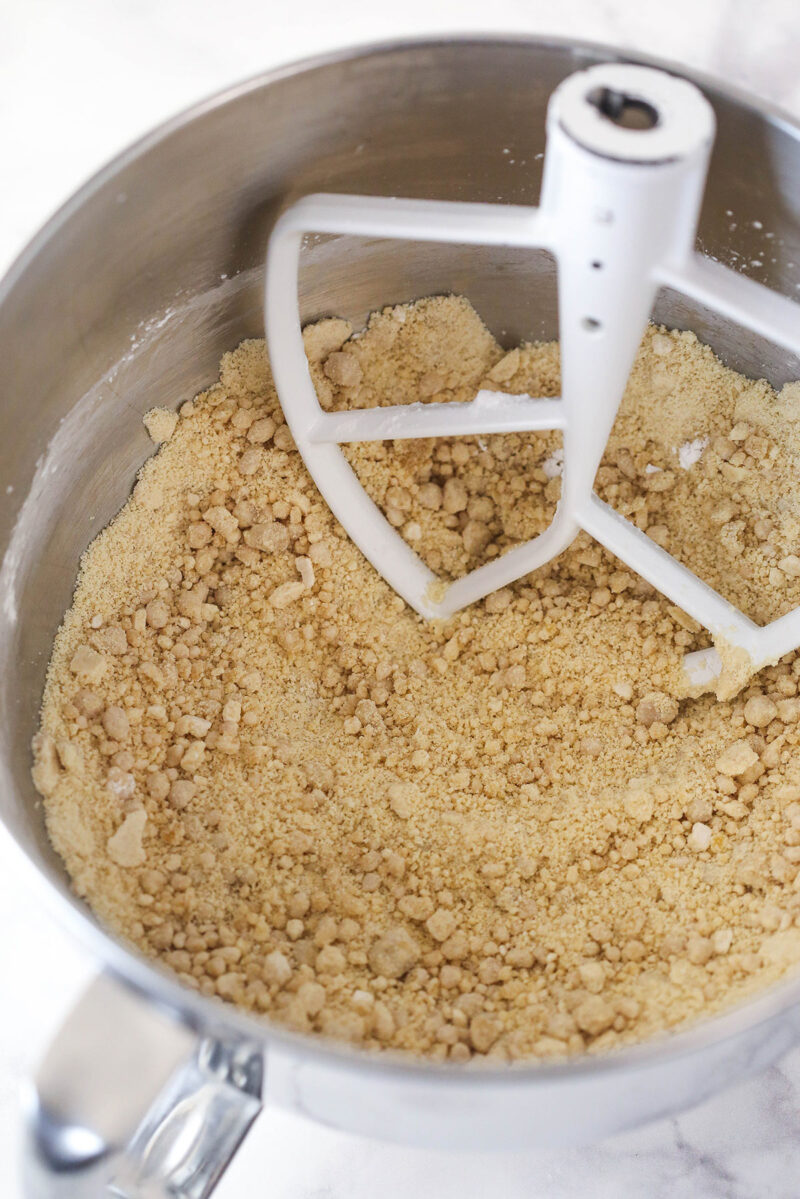 Caramel in a mixing bowl after adding some powdered sugar