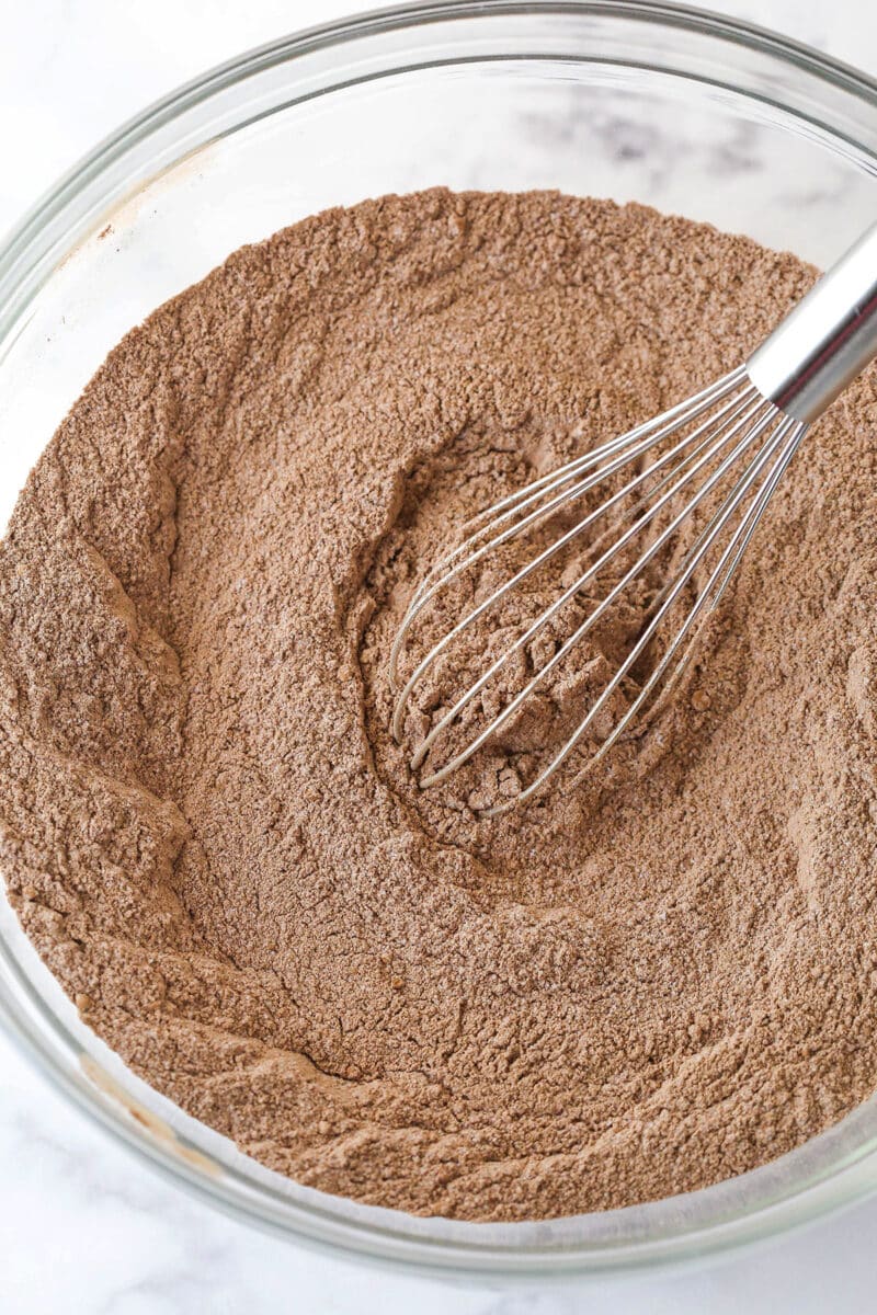 Dry chocolate cake ingredients in a bowl