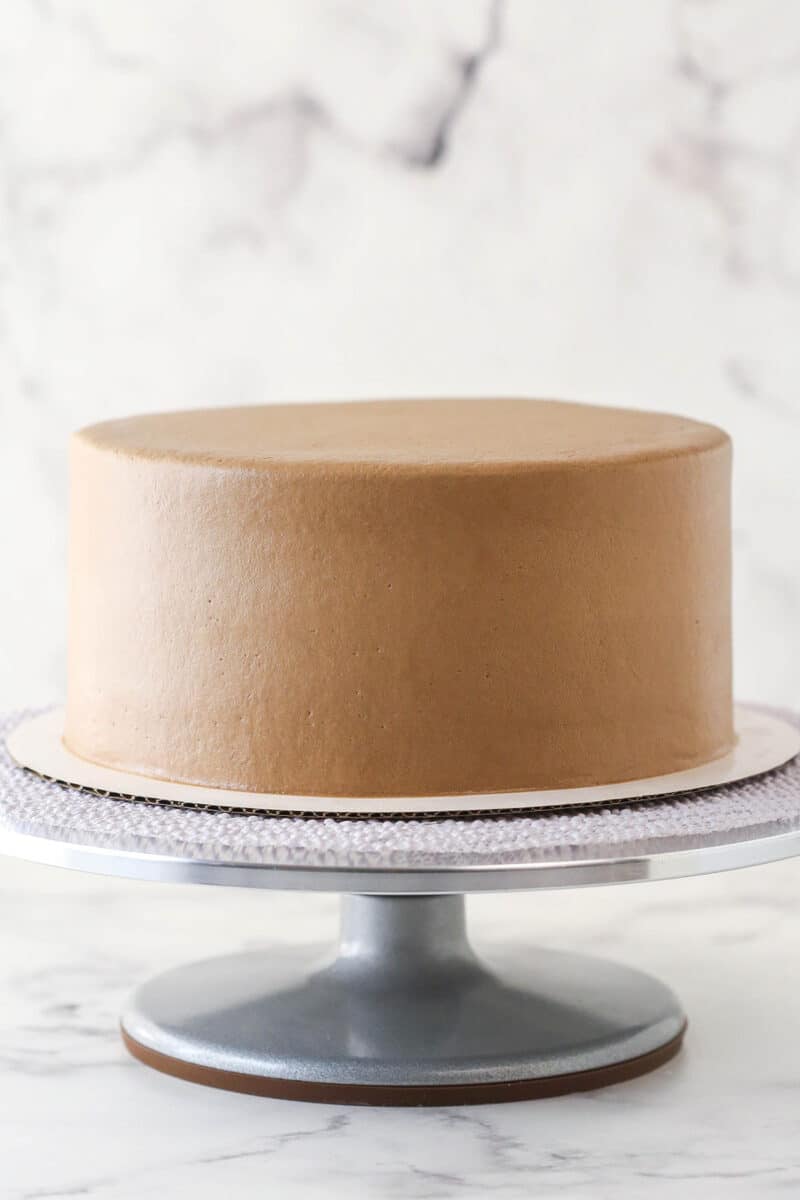 Smooth Nutella buttercream on chocolate layer cakes