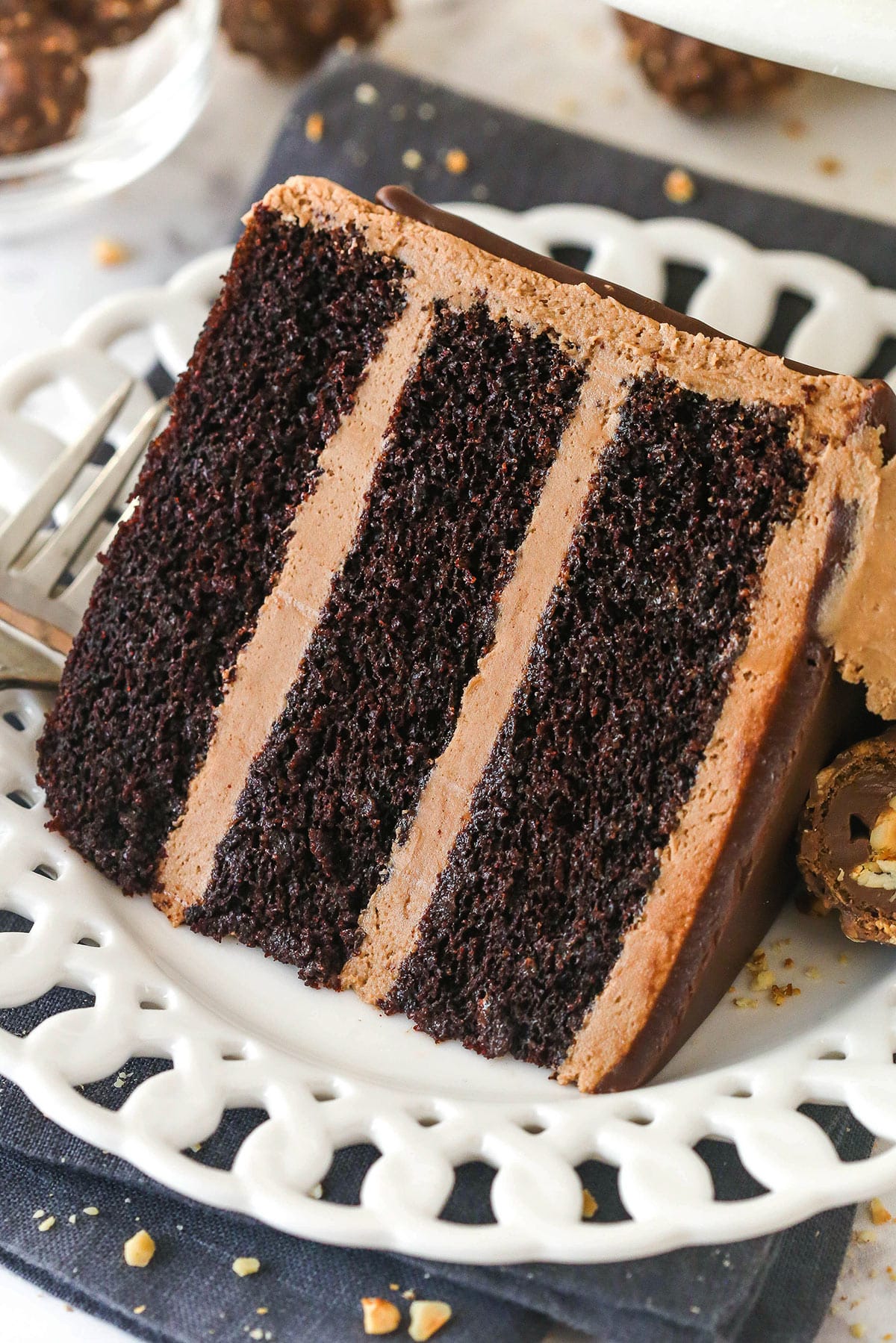 A slice of Nutella chocolate cake on a white plate