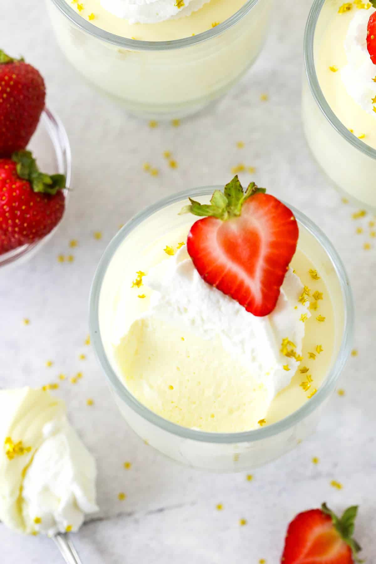 Overhead view of a glass of champagne mousse with a few bites missing