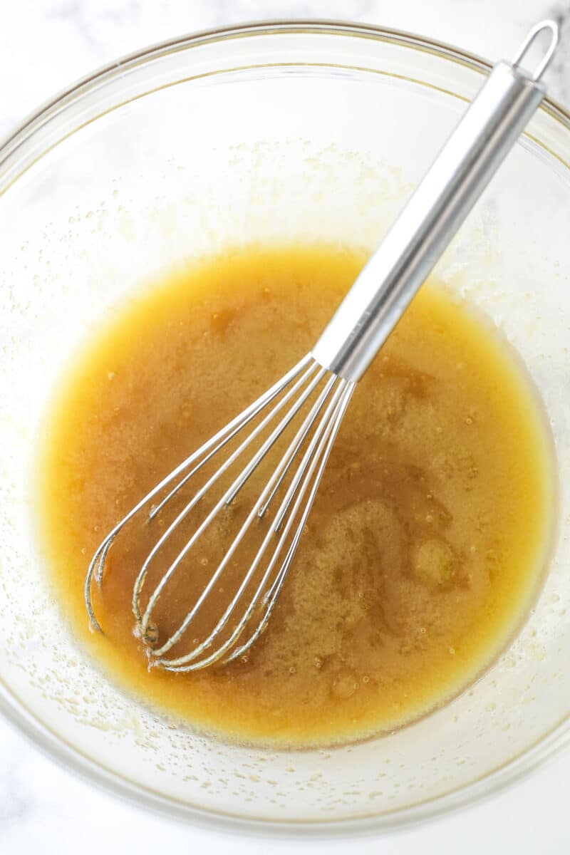 Butter, brown sugar and vanilla mixed together in glass bowl