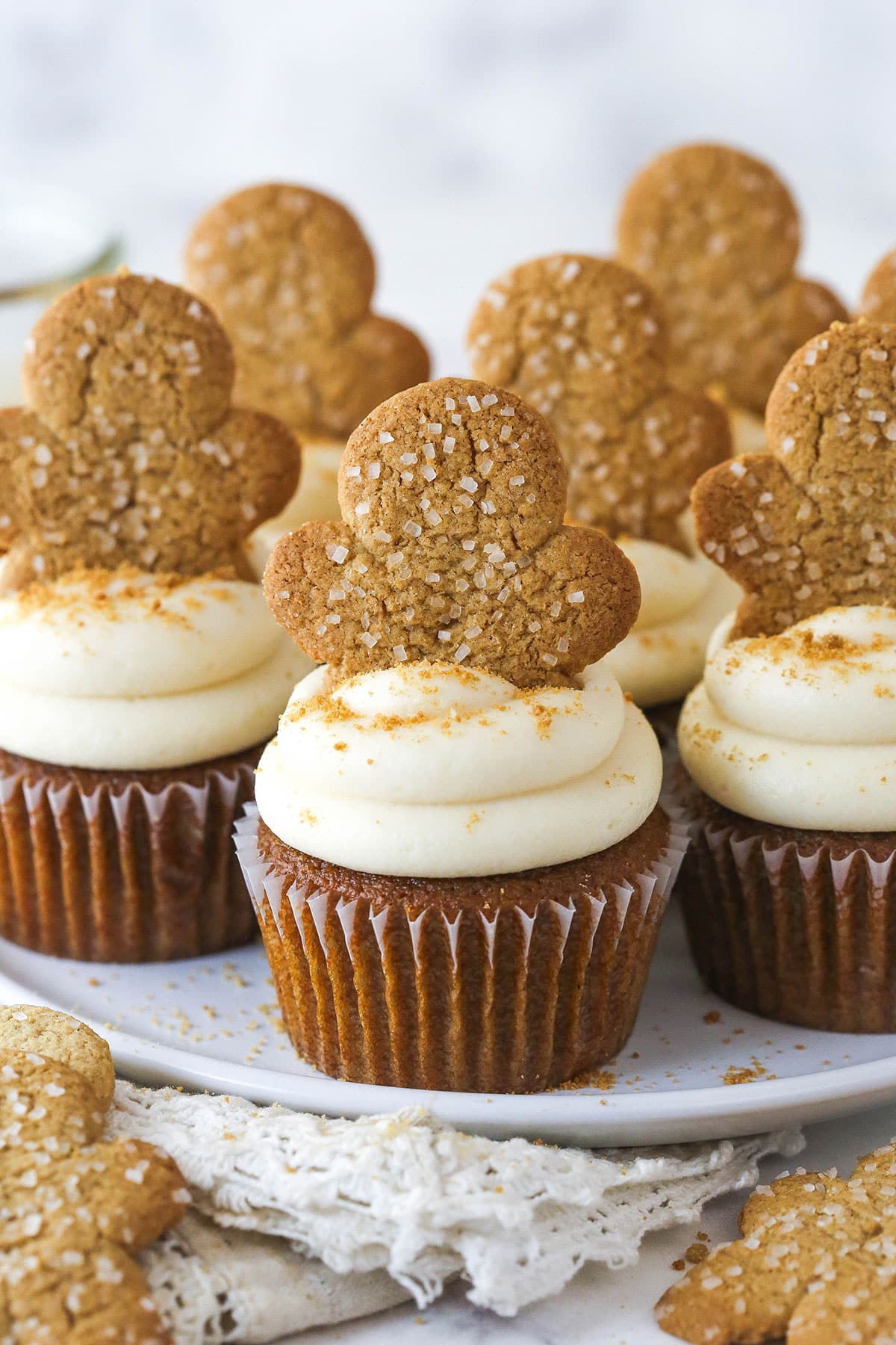 Gingerbread cupcakes with caramel frosting and a gingerbread man cookie