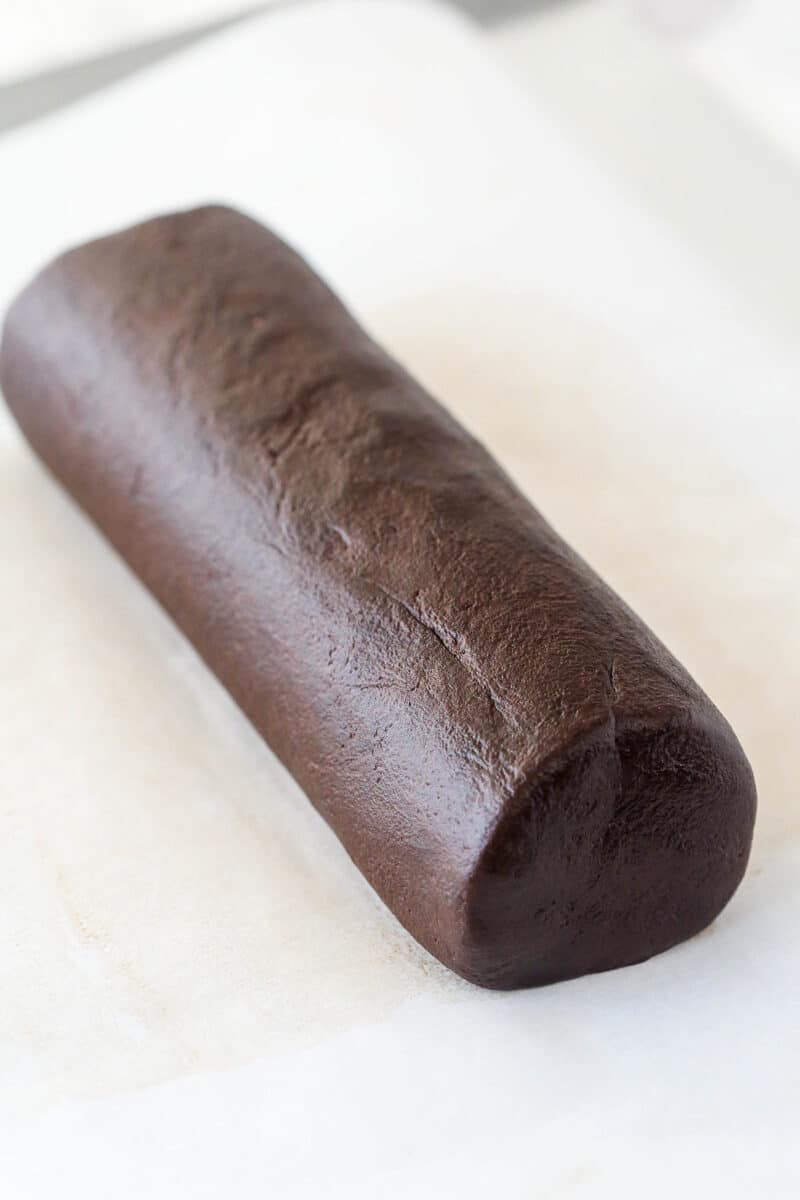 A log of chocolate shortbread cookie dough