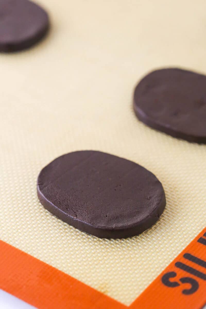 Unbaked peppermint chocolate shortbread cookies on the baking sheet