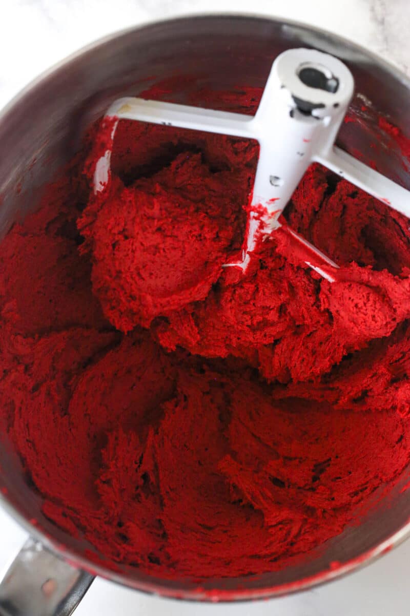 Red velvet cookie dough in a mixing bowl