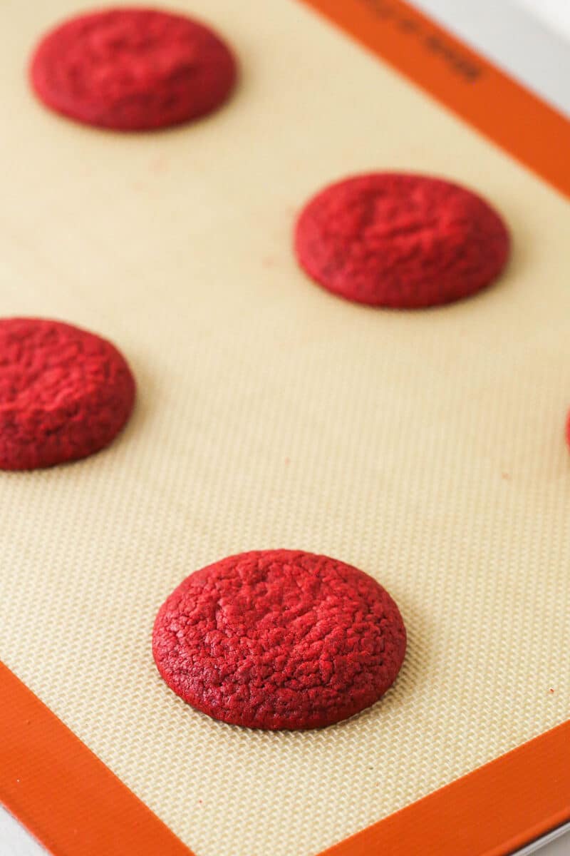 Red velvet cookies on a baking sheet