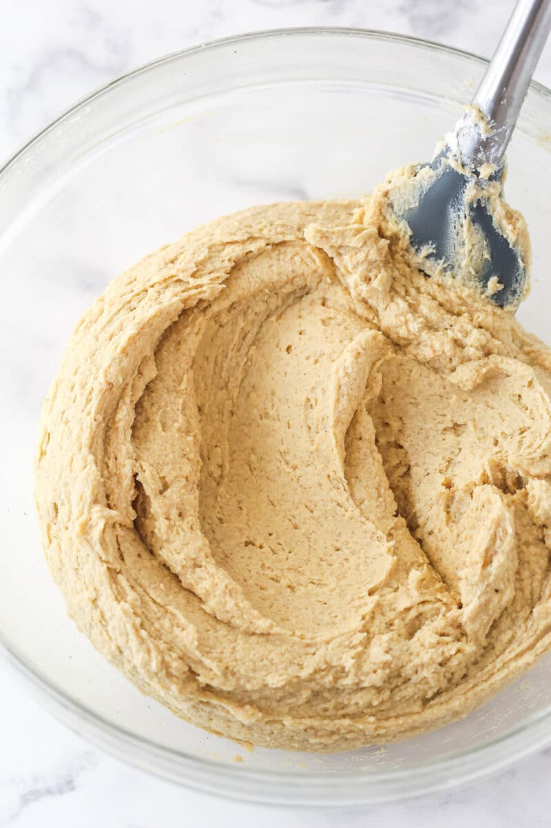 whipped cream added to the peanut butter mixture in glass bowl