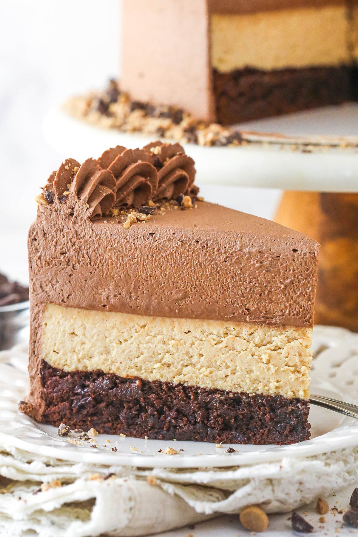 slice of peanut butter chocolate mousse cake on a white plate