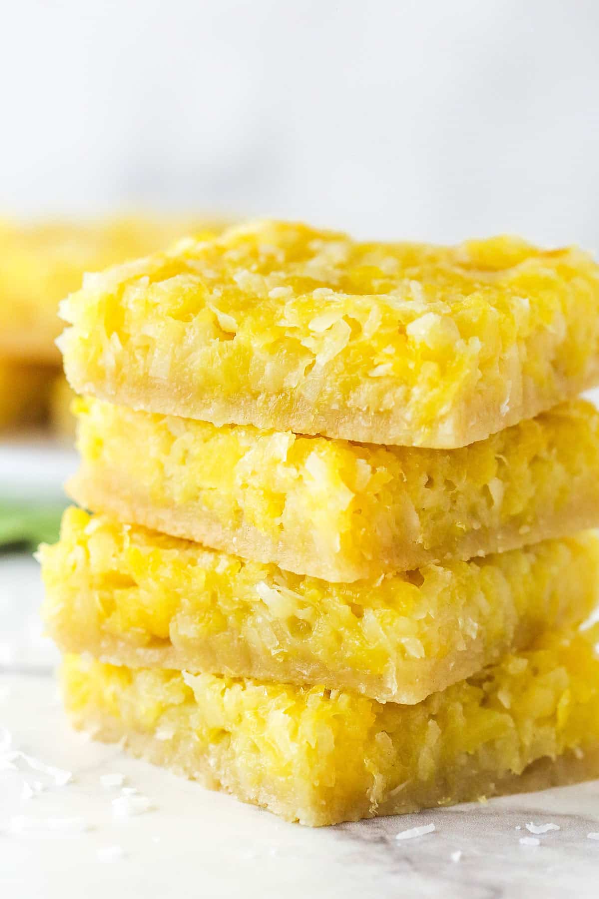 stack of four pineapple coconut bars close up