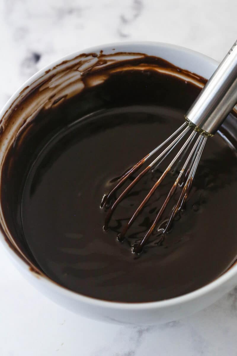 Whisking chocolate ganache in a bowl