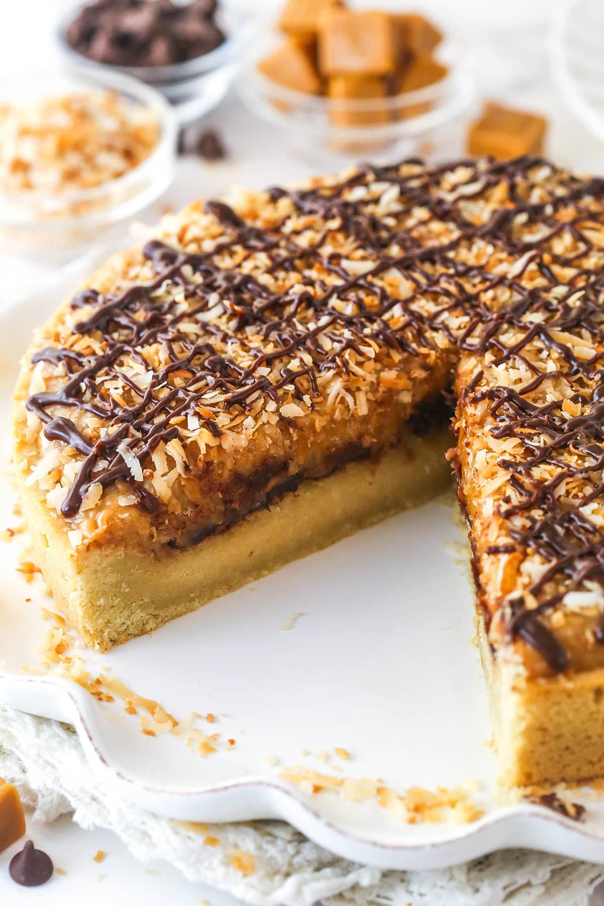 A Samoa cookie cake with one slice missing