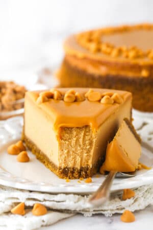 A butterscotch cheesecake with a bite on a fork