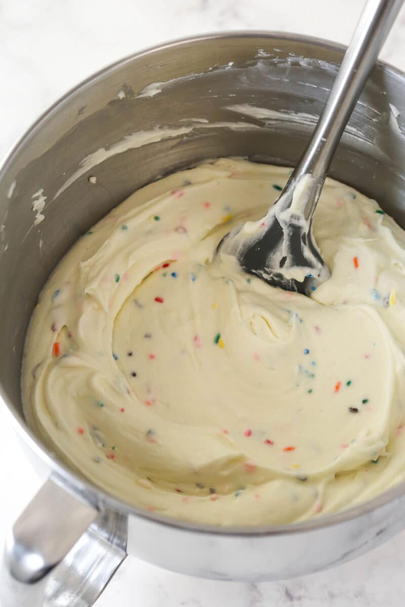 Folding sprinkles into no bake cheesecake filling