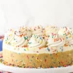 A funfetti no bake cheesecake on a white plate