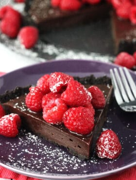 Nutella Raspberry Tart slice on purple plate