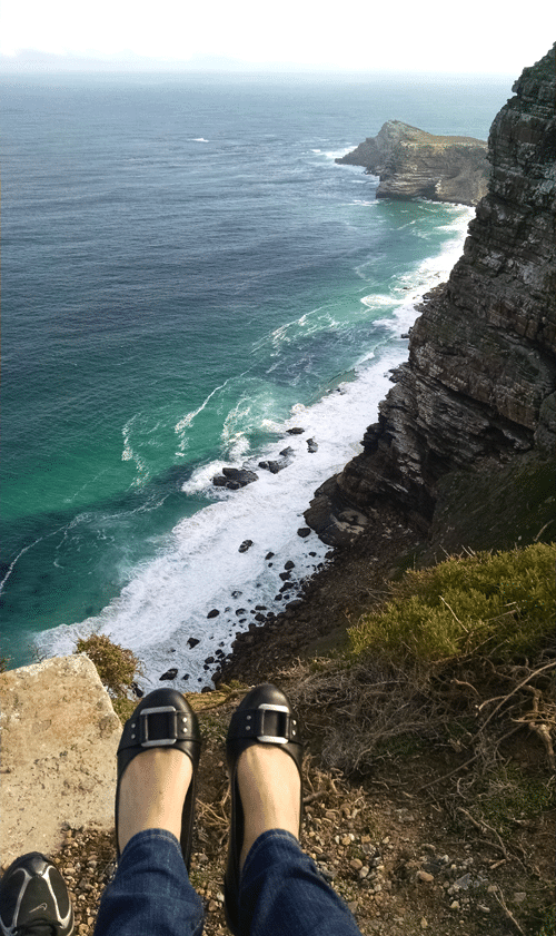 My feet dangling over the edge of a peak in South Africa.