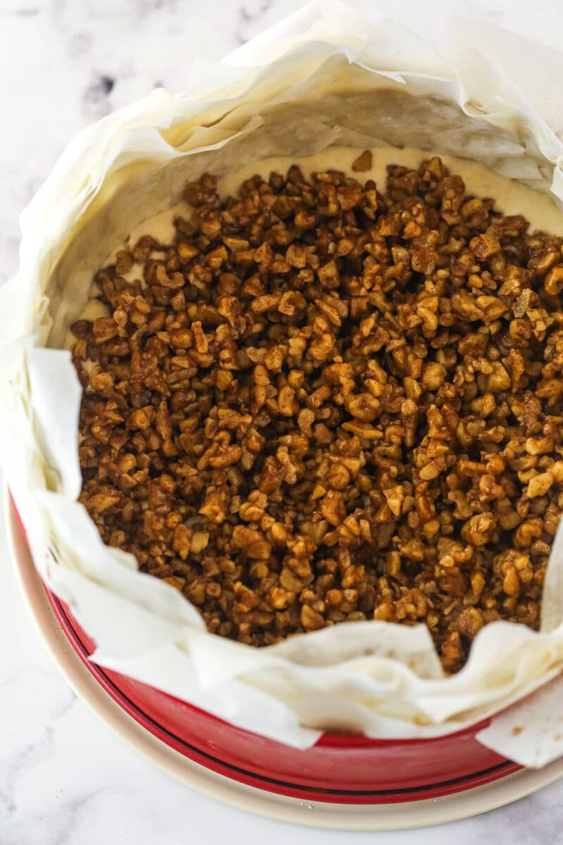 Walnut Filling added to cheesecake filling in a phyllo dough crust