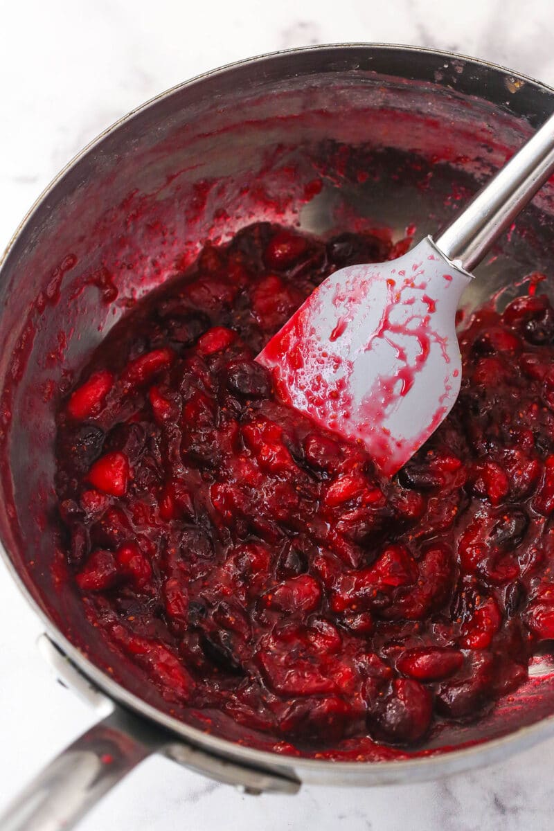 Stirring the cranberries on the stovetop