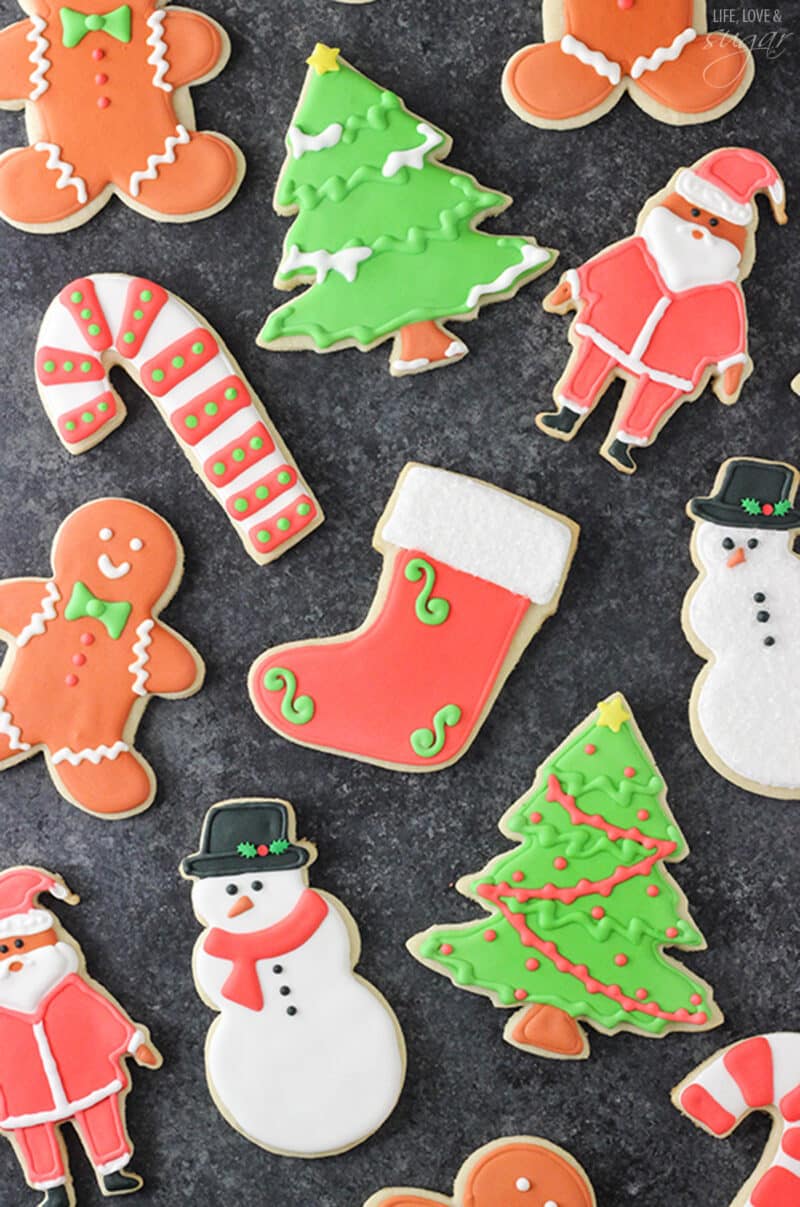 decorated cutout sugar cookies on black background