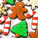 decorated Christmas cutout cookies on a marble countertop