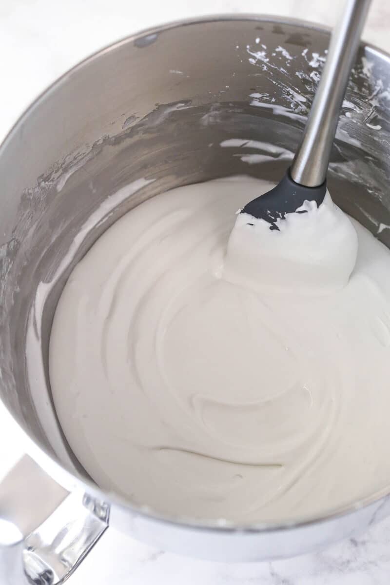 royal icing in mixing bowl after being thinned out a bit