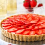 strawberry champagne tart on silver platter