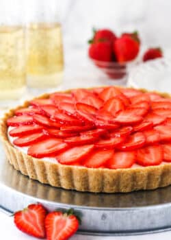 strawberry champagne tart on silver platter