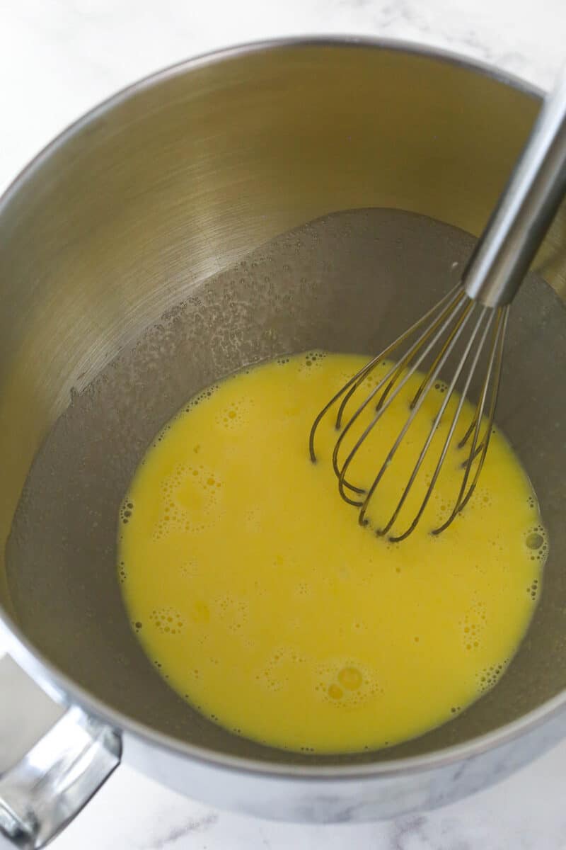 Whisking the egg yolks in a double boiler