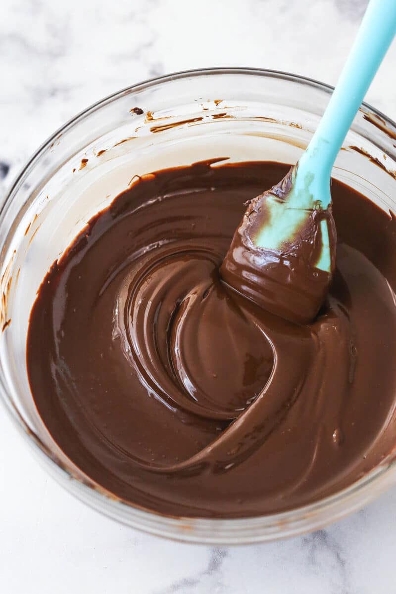 A spatula stirring melted chocolate